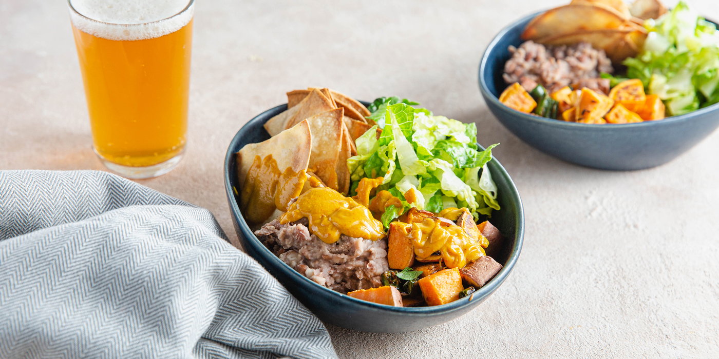 Roasted Vegetable Nacho Bowls with Refried Beans & Cashew Queso