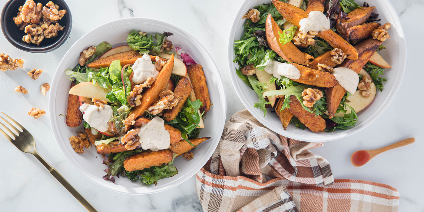 Buffalo Tempeh Harvest Bowls with Roasted Sweet Potatoes & Candied Walnuts