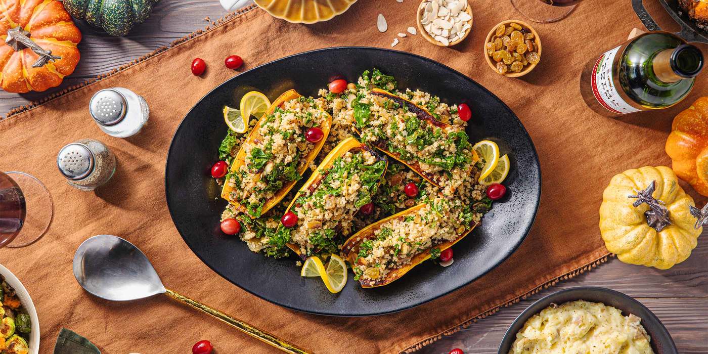 Quinoa Stuffed Delicata Squash with Garlicky Kale & Golden Raisins