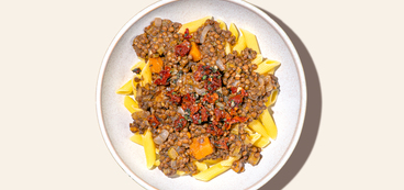Squash Bolognese gluten-free penne, fried sage, sun-dried tomatoes