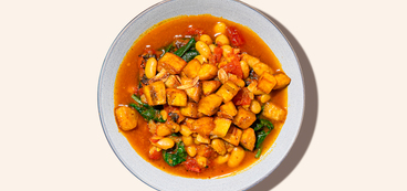Tomato-White Bean Curry crispy garlic plantains, spinach