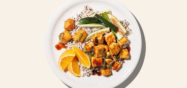 Orange Tofu quinoa-speckled rice, roasted zucchini