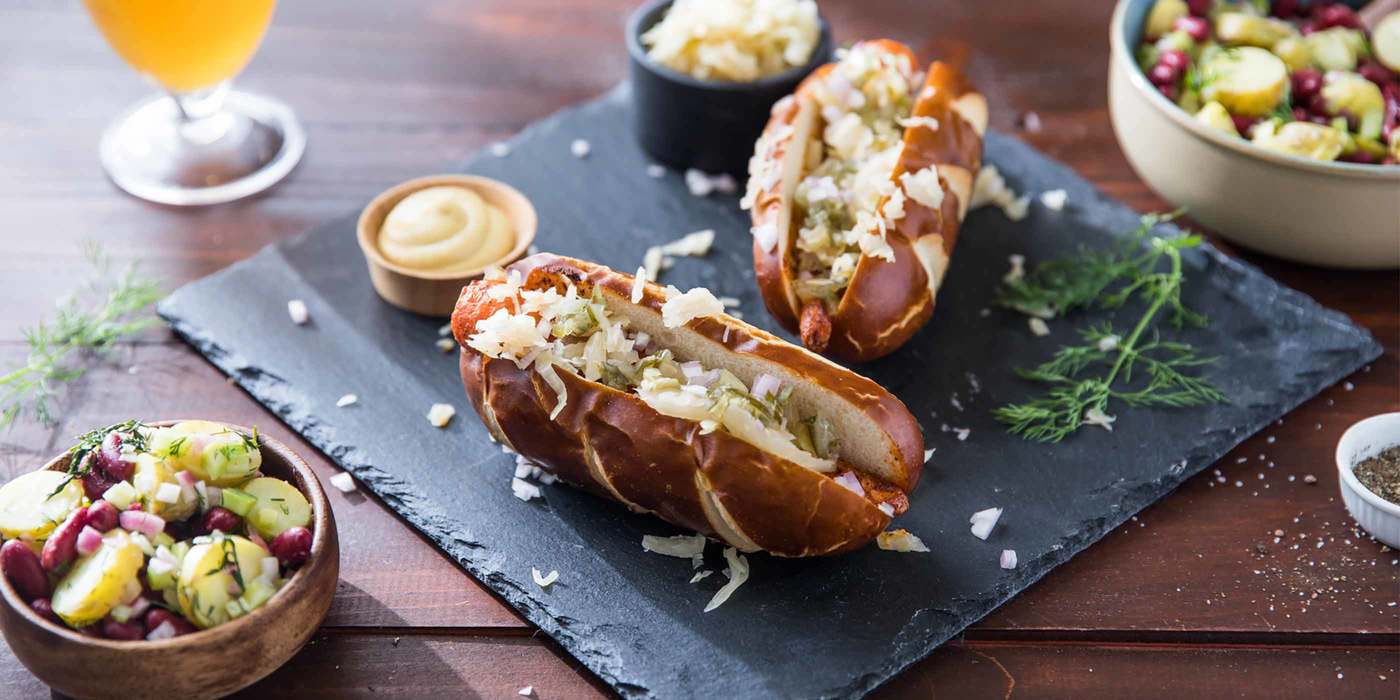 German-Style Carrot Dogs with Pretzel Buns and Dijon Potato Salad