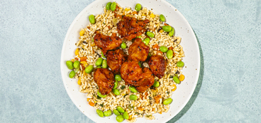 Spicy KFC Fried Rice white rice, mixed veggies, fried “chicken,” gochujang sauce
