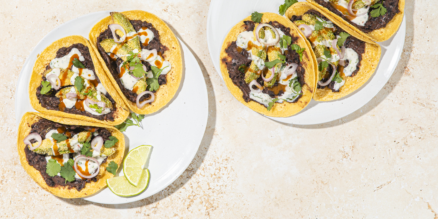 Polenta-Crusted Avocado Tacos refried black beans, pickled shallot, cilantro crema