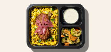 Vibrant Falafel Bowl pickled veggies, turmeric orzo, tzatziki