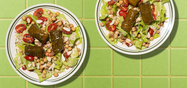 Dolma Chopped Salad chickpea tapenade, stuffed grape leaves, lemon-tahini dressing