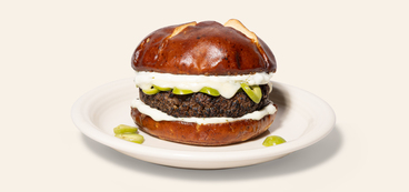 Easy Cheesy Olive Burgers plant-based mozzarella, tzatziki sauce, kalamata olives
