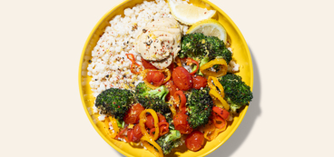 Roasted Veggie Couscous Bowls hummus, broccoli, peppers