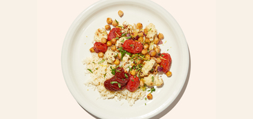 Chickpea Cauliflower Bake spiced veggies, harissa, white rice