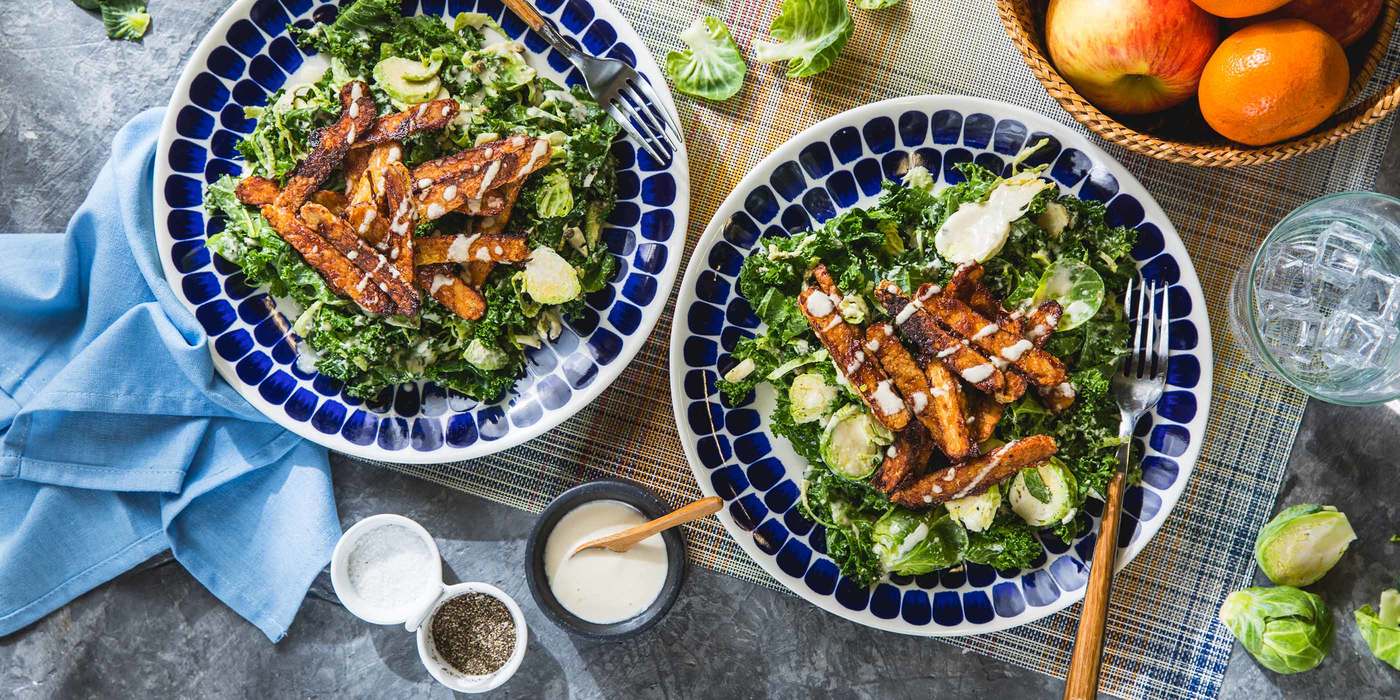 Kale Brussels Sprout Caesar Salad with BBQ Tempeh & Cashew Dressing