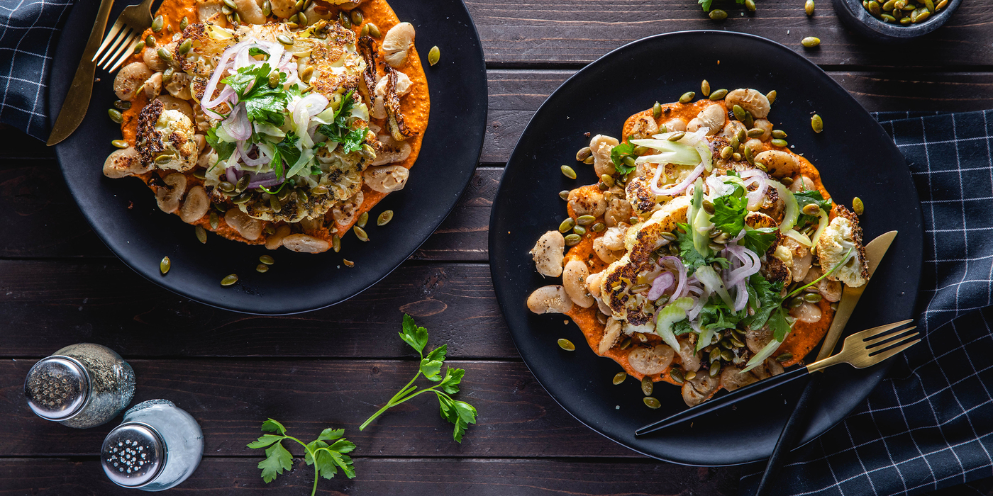 Cauliflower Steaks with Pepita Romesco Sauce & Crispy White Beans